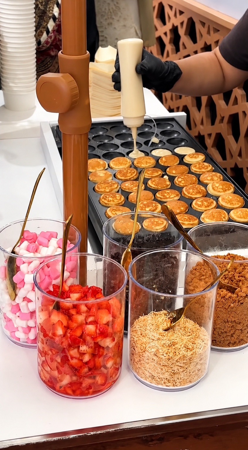 Dessert station with sauces and toppings