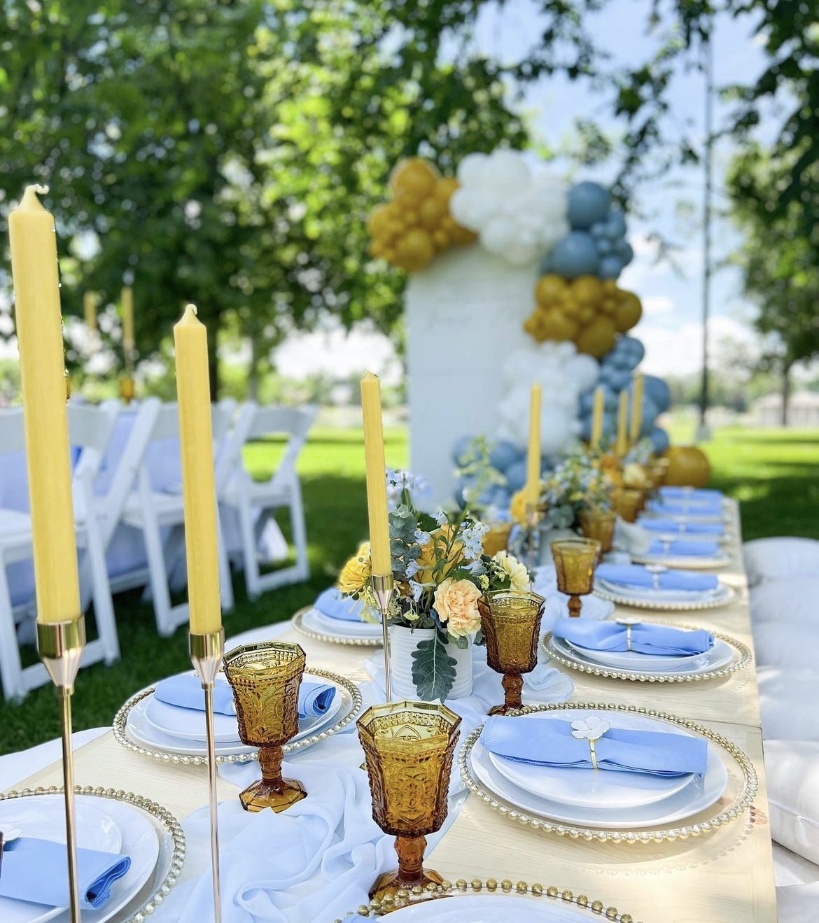 Garden celebration with pale blue linens and gold details