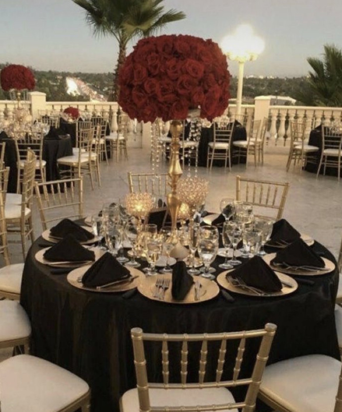 Formal celebration with black linens and gold chairs